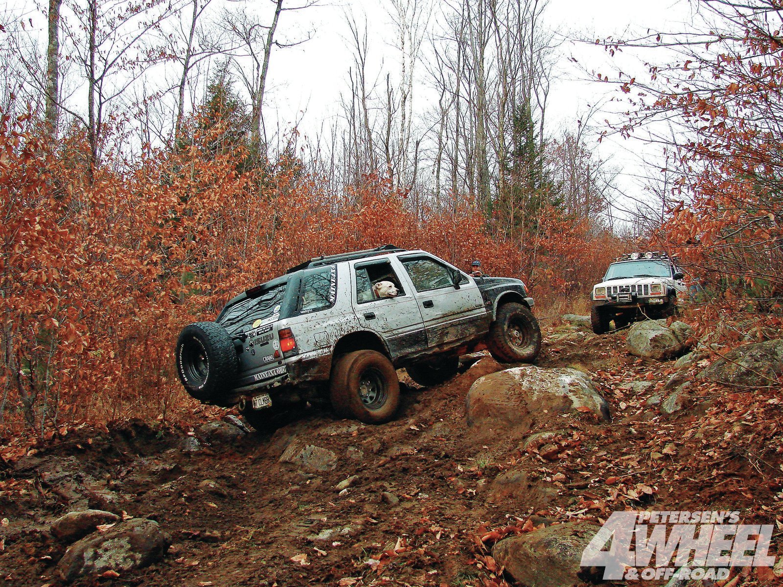 131 1106 07 o131 1106 off roading in a maine 4x4 areaisuzu climbing up hill