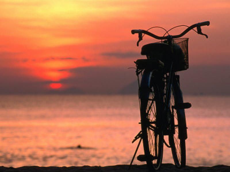 S 00034 banagan-john-bicycle-silhouetted-against-sunset-on-nha-trang-beach-nha-trang-khanh-hoa-vietn