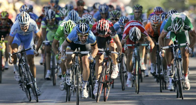 TF 0040 Mark Cavendish of Great Britain center grimaces as he strains to win the 13th stage of the