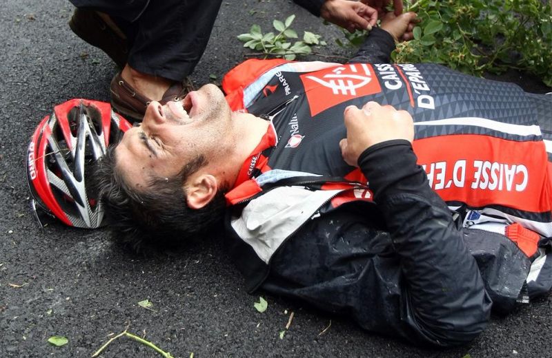 TF 0049 Oscar Pereiro receives medical assistanceafter he toppled over a security barrier on his w